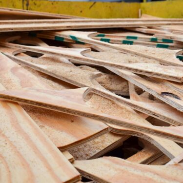 Plywood offcuts in a skip