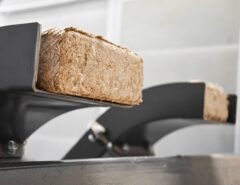 Discharge of wood briquettes from a GROSS GP 400 briquette press